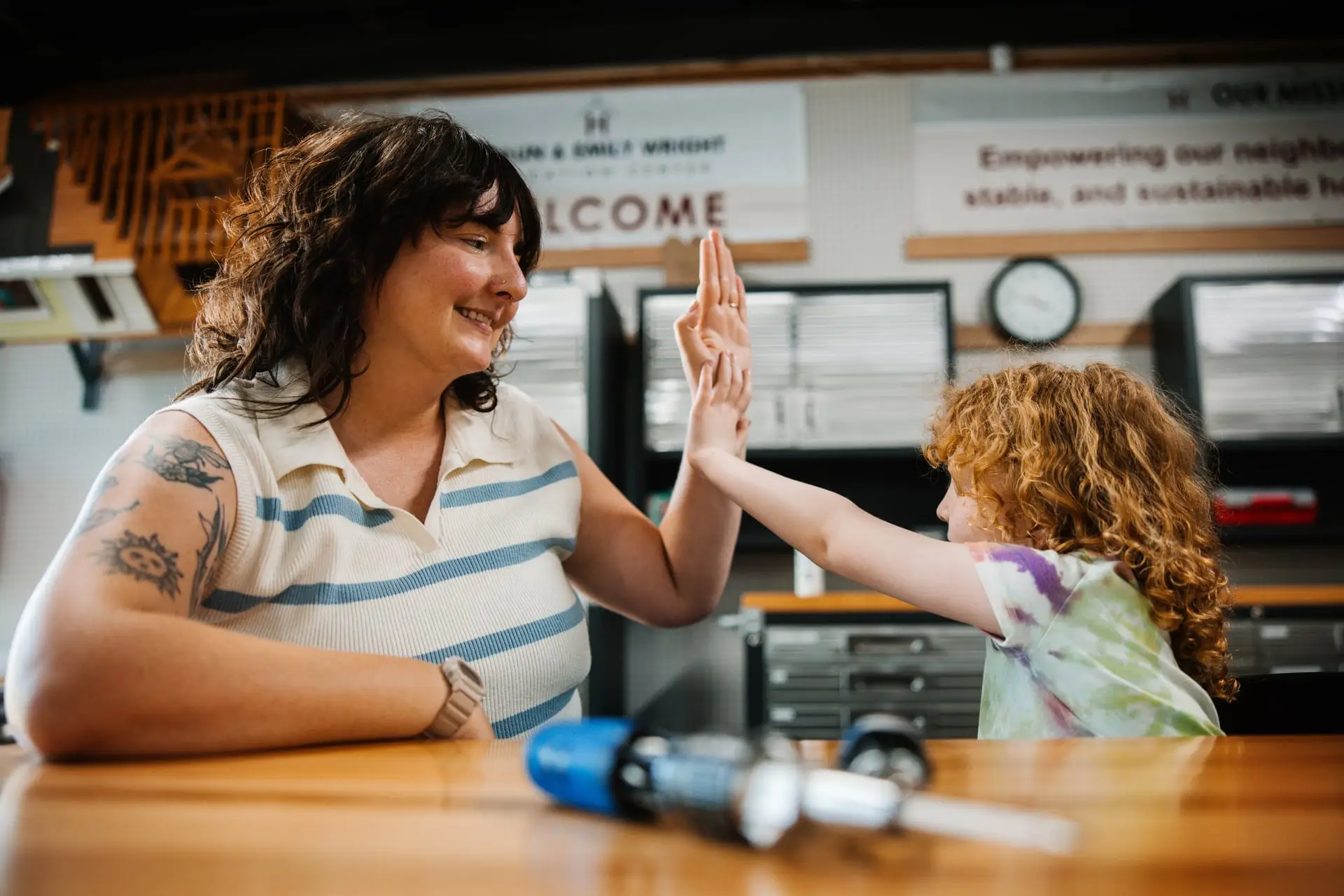 Mother and daughter giving a high-five.