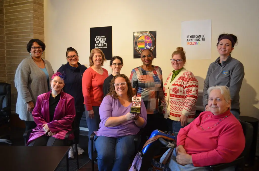 Group of woman celebrating their Gingerbread House Contest win.